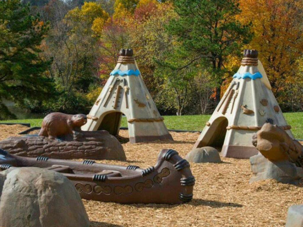 Indigenous Playground including canoes, teepees and animal elements