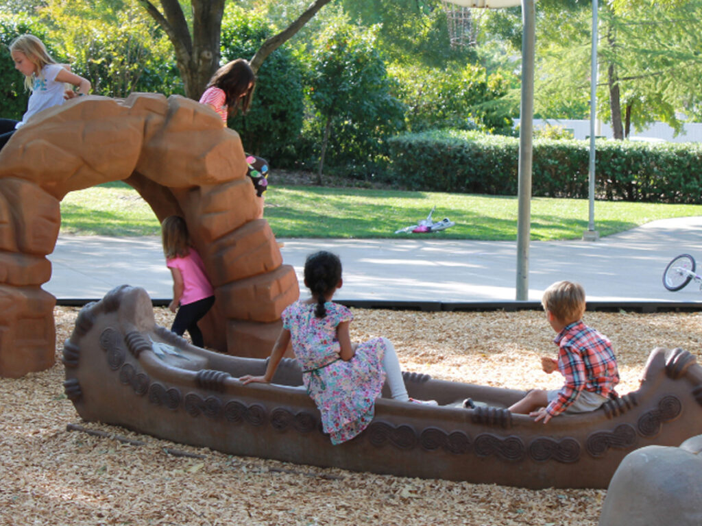 Indigenous Playground with rock formation and canoe